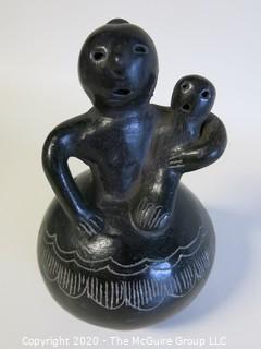 Hand Made Black Clay Pottery Figure of Mother with Child. In the style of Barro Negro Pottery of Oaxaca, Mexico. Measures approximately 3" X 5"