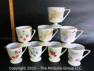 Set of 8 Floral Patterned Porcelain Footed Cups and Urn.  Hand Painted and signed by Artist. 