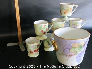 Set of 8 Floral Patterned Porcelain Footed Cups and Urn.  Hand Painted and signed by Artist. 