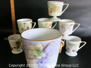 Set of 8 Floral Patterned Porcelain Footed Cups and Urn.  Hand Painted and signed by Artist. 