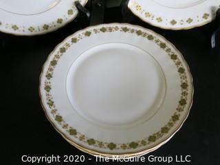 Set of 6 Gilt Decorated Porcelain Plates made by Elite Works Limoges.  Made in France. Approximately 10" in diameter.