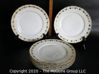 Set of 6 Gilt Decorated Porcelain Plates made by Elite Works Limoges.  Made in France. Approximately 10" in diameter.