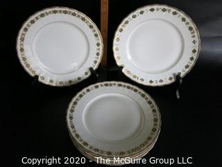 Set of 6 Gilt Decorated Porcelain Plates made by Elite Works Limoges.  Made in France. Approximately 10" in diameter.