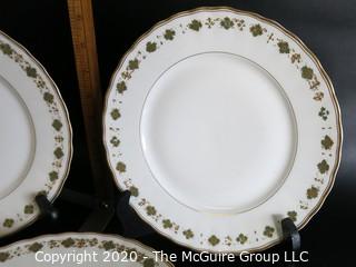 Set of 6 Gilt Decorated Porcelain Plates made by Elite Works Limoges.  Made in France. Approximately 10" in diameter.