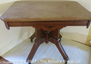 Marble top side table on carved base with castors; 17 1/2 x 25 x 19 1/2"T 