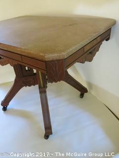 Marble top side table on carved base with castors; 17 1/2 x 25 x 19 1/2"T 