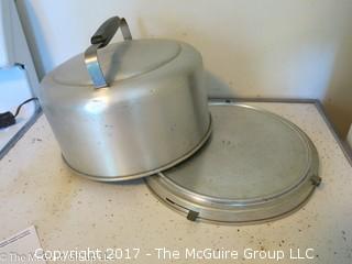 Collection of kitchenware including covered baking pots, and an aluminum pie/cake carrier