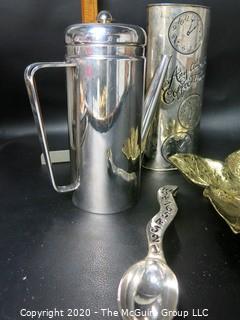 Group of 4 Metal ware Items.  Includes Silver Plate Coffee Server from Italy, Silver Plate Neiman Marcus Cannister and Spoon and Brass Virginia Metalcrafters Leaf Dish.  