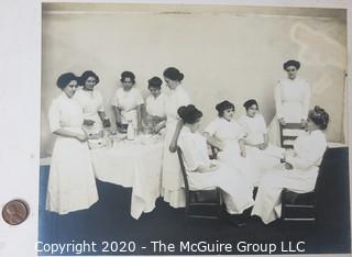 Black and White Photo of Nurses on Break.  Mounted on Photo Board. Measure approximately 14" x 11" with Board.  Some damage to edge. 