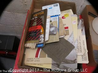 Assorted tool room supplies including bins, sandpaper, funnels and masonry tools 