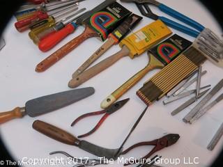 Assortment including paint brushes, screwdrivers, stapler, sledge hammer metal files, metal punches, wall paper tools, plumb bob.... 