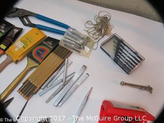 Assortment including paint brushes, screwdrivers, stapler, sledge hammer metal files, metal punches, wall paper tools, plumb bob.... 