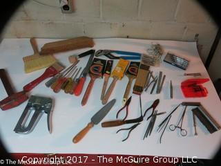 Assortment including paint brushes, screwdrivers, stapler, sledge hammer metal files, metal punches, wall paper tools, plumb bob.... 