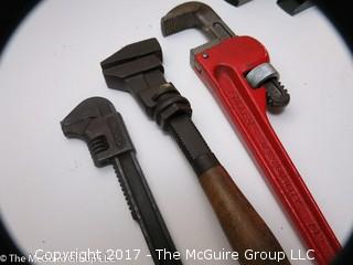 Tools including new and old pipe wrenches, Dremel type tool, C clamps, hole saws, planes, ....