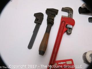 Tools including new and old pipe wrenches, Dremel type tool, C clamps, hole saws, planes, ....