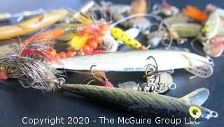 Large Group of Fishing Lures in a Variety of Shapes, Colors and Materials.