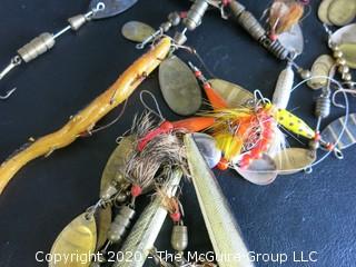 Large Group of Fishing Lures in a Variety of Shapes, Colors and Materials.