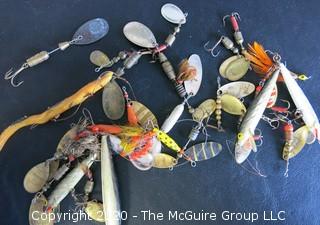 Large Group of Fishing Lures in a Variety of Shapes, Colors and Materials.