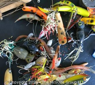 Large Group of Fishing Lures in a Variety of Shapes, Colors and Materials.