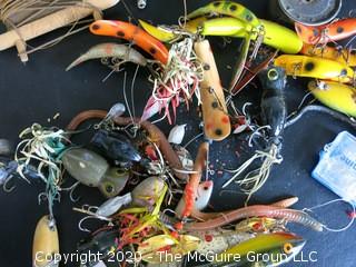 Large Group of Fishing Lures in a Variety of Shapes, Colors and Materials.