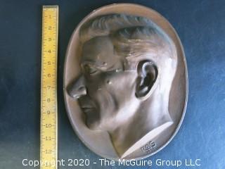 Large Plaque Made of Plaster with Copper Color Paint of Man in Profile.  Signed RAS 1933 with Wall Hanger.  Measures Approximately 12" Long.