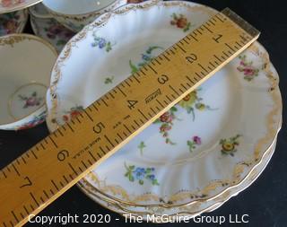 Partial Set of Dresden China China with Floral Decoration and Gold Gilt Edges.  