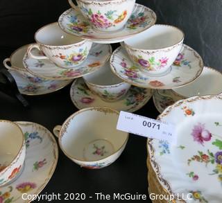 Partial Set of Dresden China China with Floral Decoration and Gold Gilt Edges.  