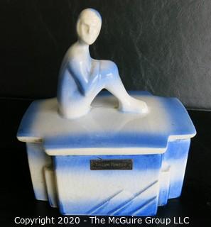 Blue and White Art Deco Pottery Talcom Powder Box with Figure on Lid.  Some chips on edges. .  Measures approximately 5 1/2" x 5".
