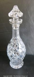 Cut Crystal Decanter with Stopper. Measures approximately 13" tall.