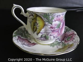 Porcelain Bone China Teacup and Saucer in the Flower of the Month Series, Poppy, made by Royal Albert in England.