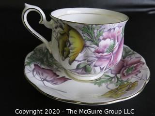 Porcelain Bone China Teacup and Saucer in the Flower of the Month Series, Poppy, made by Royal Albert in England.