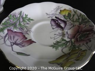 Porcelain Bone China Teacup and Saucer in the Flower of the Month Series, Poppy, made by Royal Albert in England.