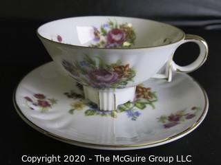 Porcelain Bone China Teacup and Saucer in floral pattern, Unmarked.