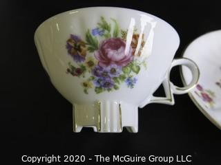 Porcelain Bone China Teacup and Saucer in floral pattern, Unmarked.