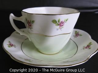 Porcelain Bone China Teacup and Saucer made by Queens in England.