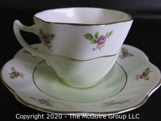 Porcelain Bone China Teacup and Saucer made by Queens in England.