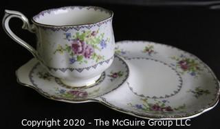 Porcelain Bone China Teacup and Toast Snack Plate in Petit Point China pattern made by Royal Albert in England.