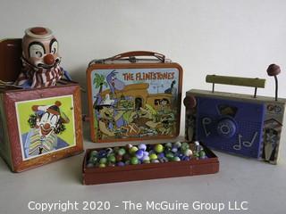 Four Vintage Children's Items.  Includes Box of Marbles, Lunch Box, Jack in the Box and Fisher Price Music Box. 