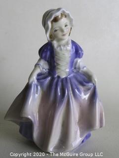 Vintage Royal Doulton Porcelain Figurine "Dinky Do". Measures approximately 5" tall.