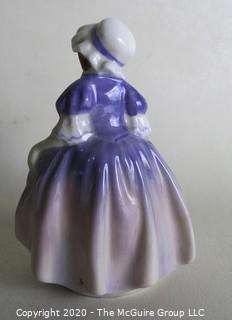 Vintage Royal Doulton Porcelain Figurine "Dinky Do". Measures approximately 5" tall.