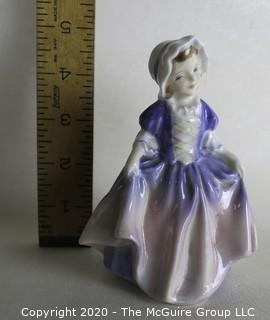 Vintage Royal Doulton Porcelain Figurine "Dinky Do". Measures approximately 5" tall.