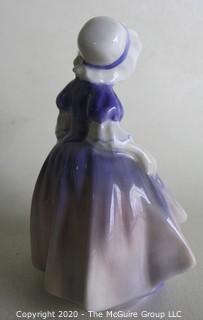 Vintage Royal Doulton Porcelain Figurine "Dinky Do". Measures approximately 5" tall.