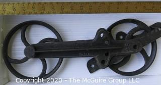 Two Old R.H. Co. Iron Pulleys.  Measures approximately 17" long. 