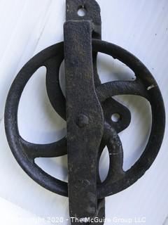 Two Old R.H. Co. Iron Pulleys.  Measures approximately 17" long. 