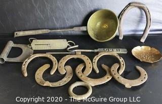 Large Group of Heavy Cast Iron and Brass Tools.  Includes Horseshoes, Hanging Scale with Brass Front, Brass Ladle, Scraper, Mule Shoe, Etc.