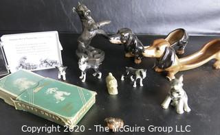 Collection of Dog Figurines of Various Materials and Playing Cards.