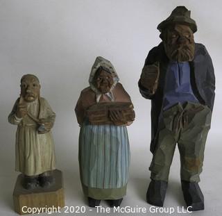 Three Carved Wooden Figurines.  