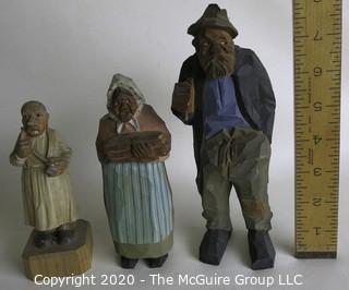 Three Carved Wooden Figurines.  