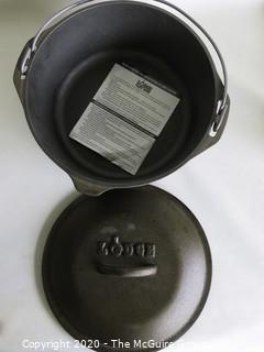 Lodge Heavy Cast Iron Pot with Lid and Handle.  New with Label inside. Measures approximately 5" x 11".