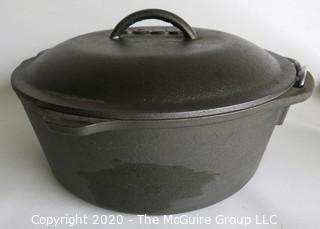 Lodge Heavy Cast Iron Pot with Lid and Handle.  New with Label inside. Measures approximately 5" x 11".